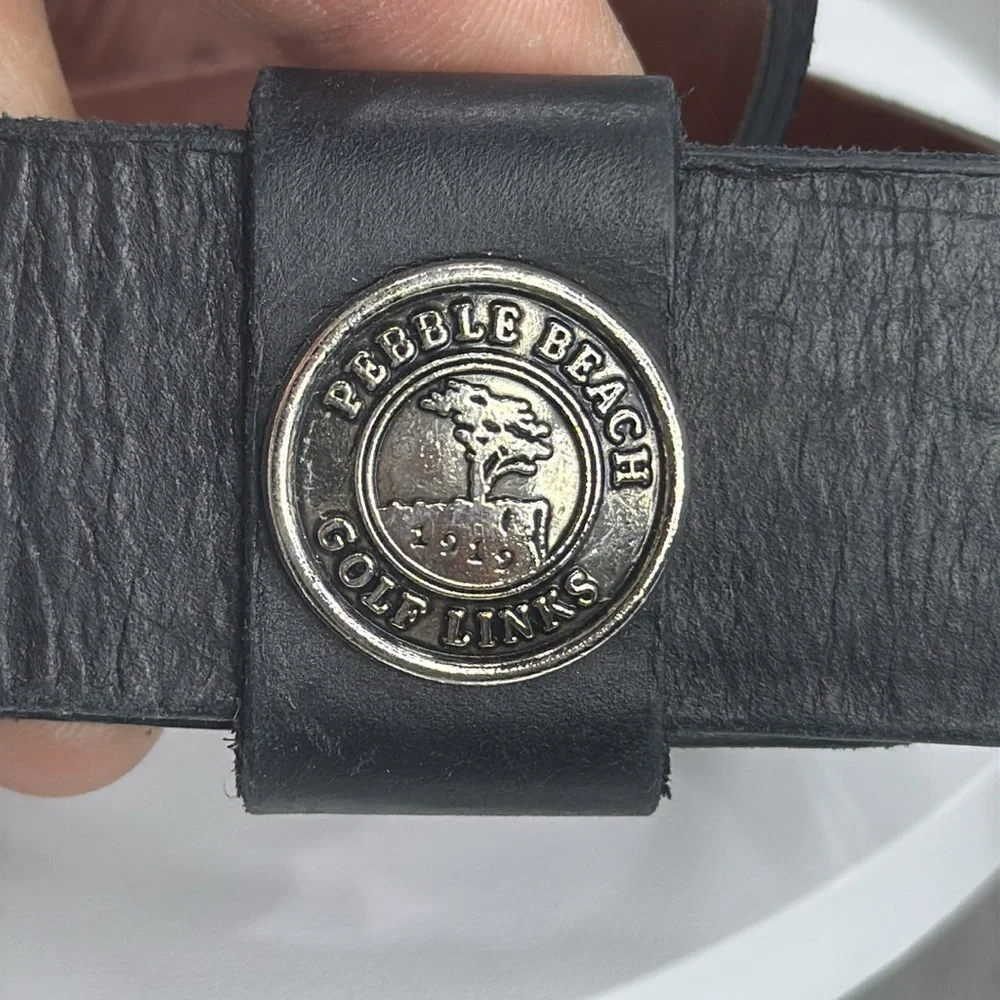 (H)Two Pebble Beach boys' leather belts with black and white metal silve buckles